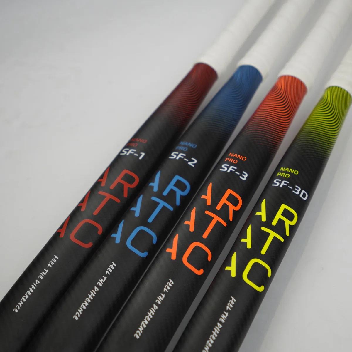 Four Aratac Nano Pro hockey sticks arranged side by side