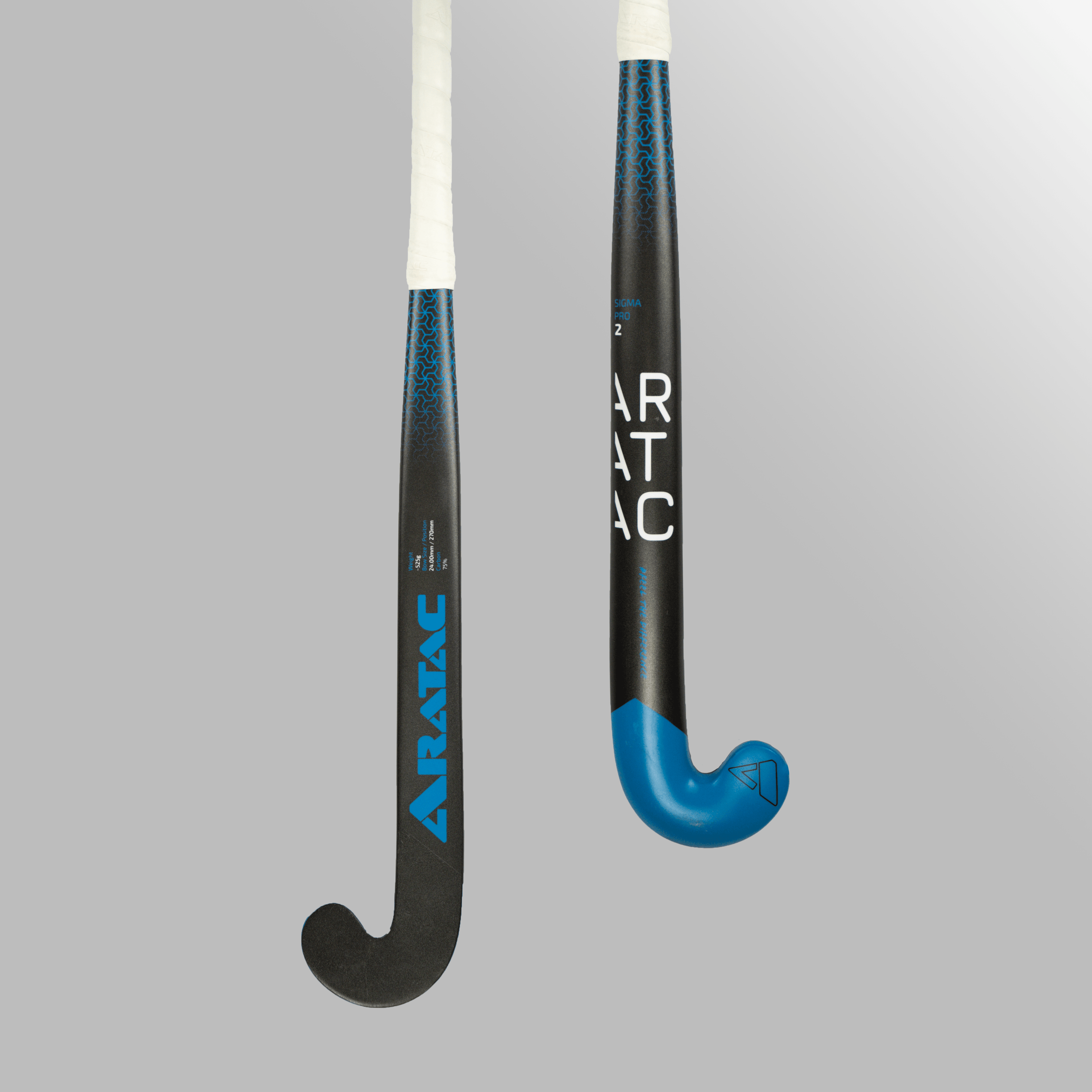 Two Aratac Sigma Pro 2 hockey sticks shown on a neutral studio background