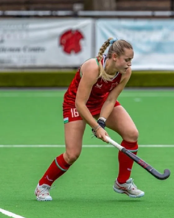 Emily Drysdale preparing to play the ball during a hockey match.